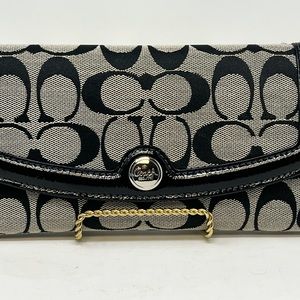 Coach. Monogram canvas and leather Wallet